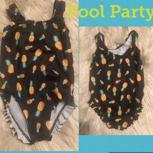 Baby swimsuit with pineapple designs
